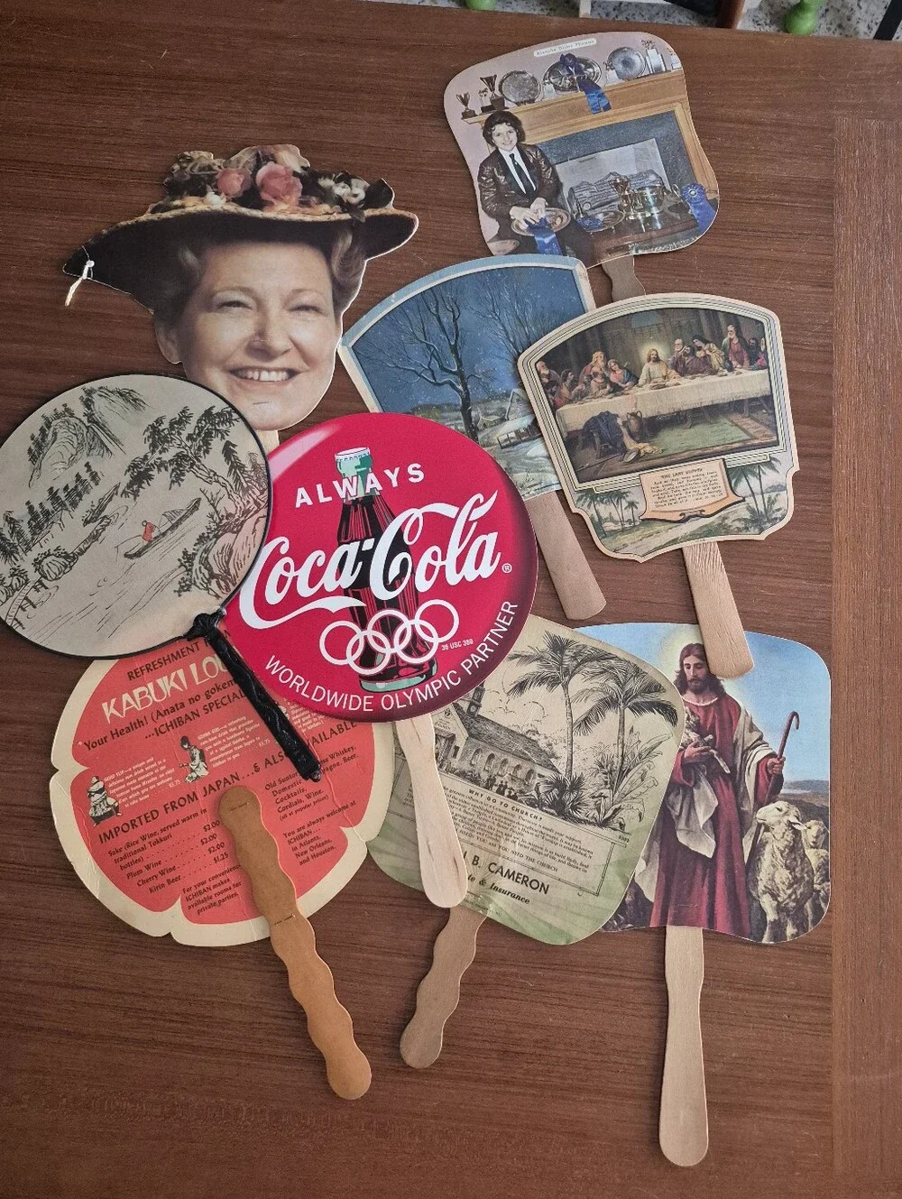 Assorted vintage advertising fans
